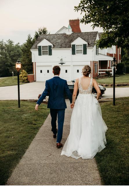 Couple walking the path toward the house