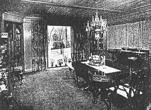 Historic photo of the chestnut-paneled dining room