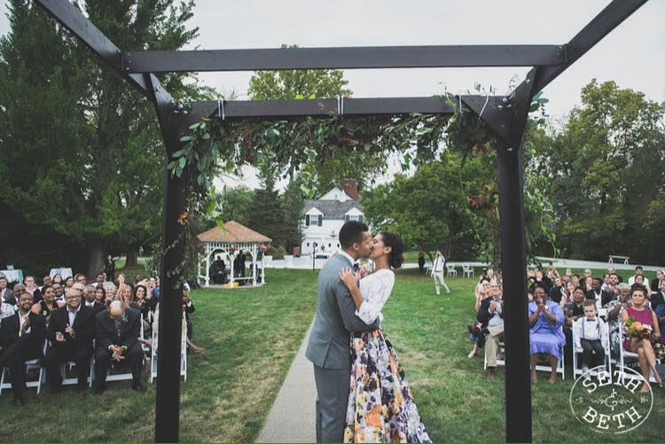 First kiss under the ceremony arbor