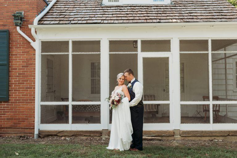 Couple in front of the house sunporch